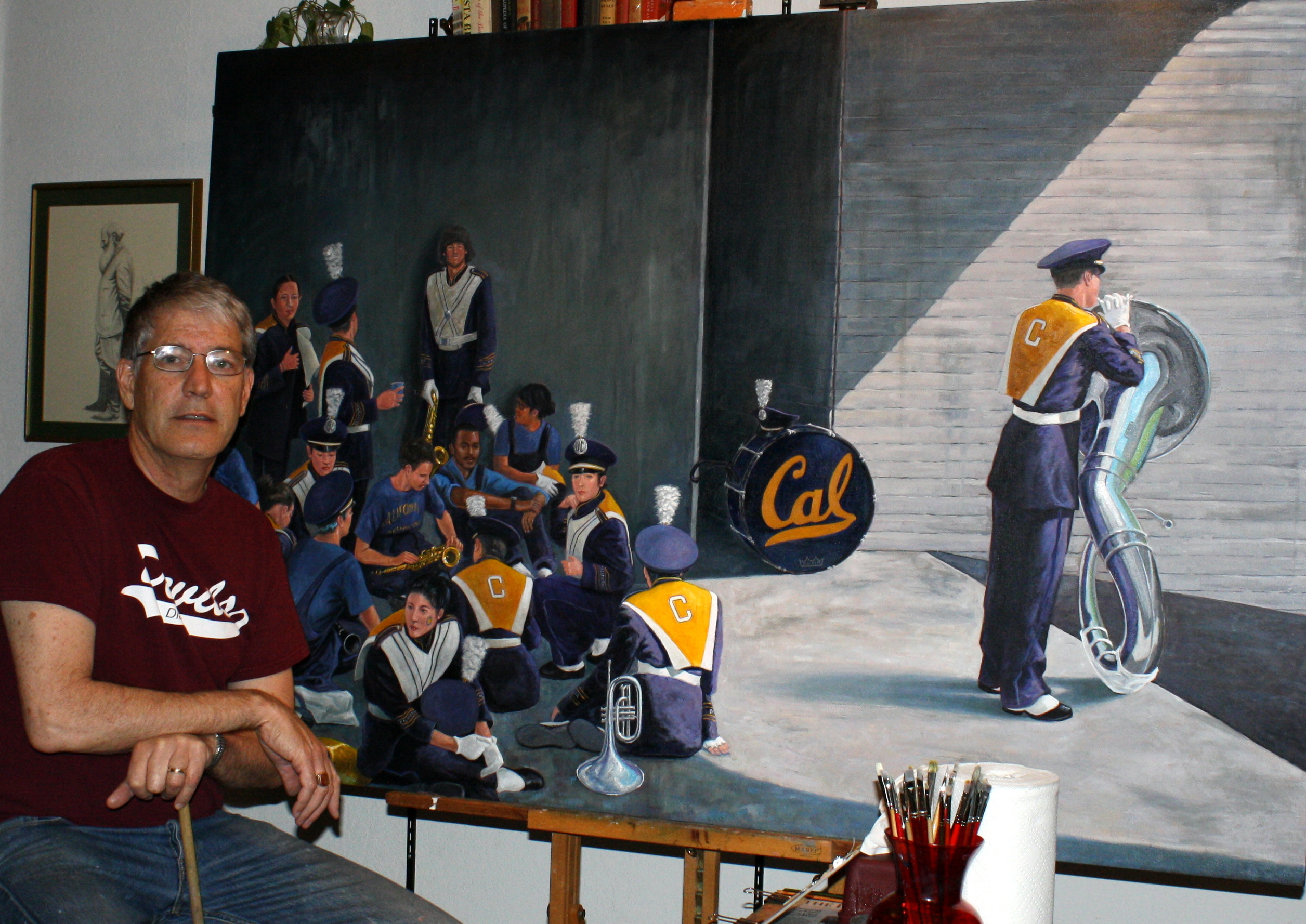 Artist in Studio with Cal Band Painting