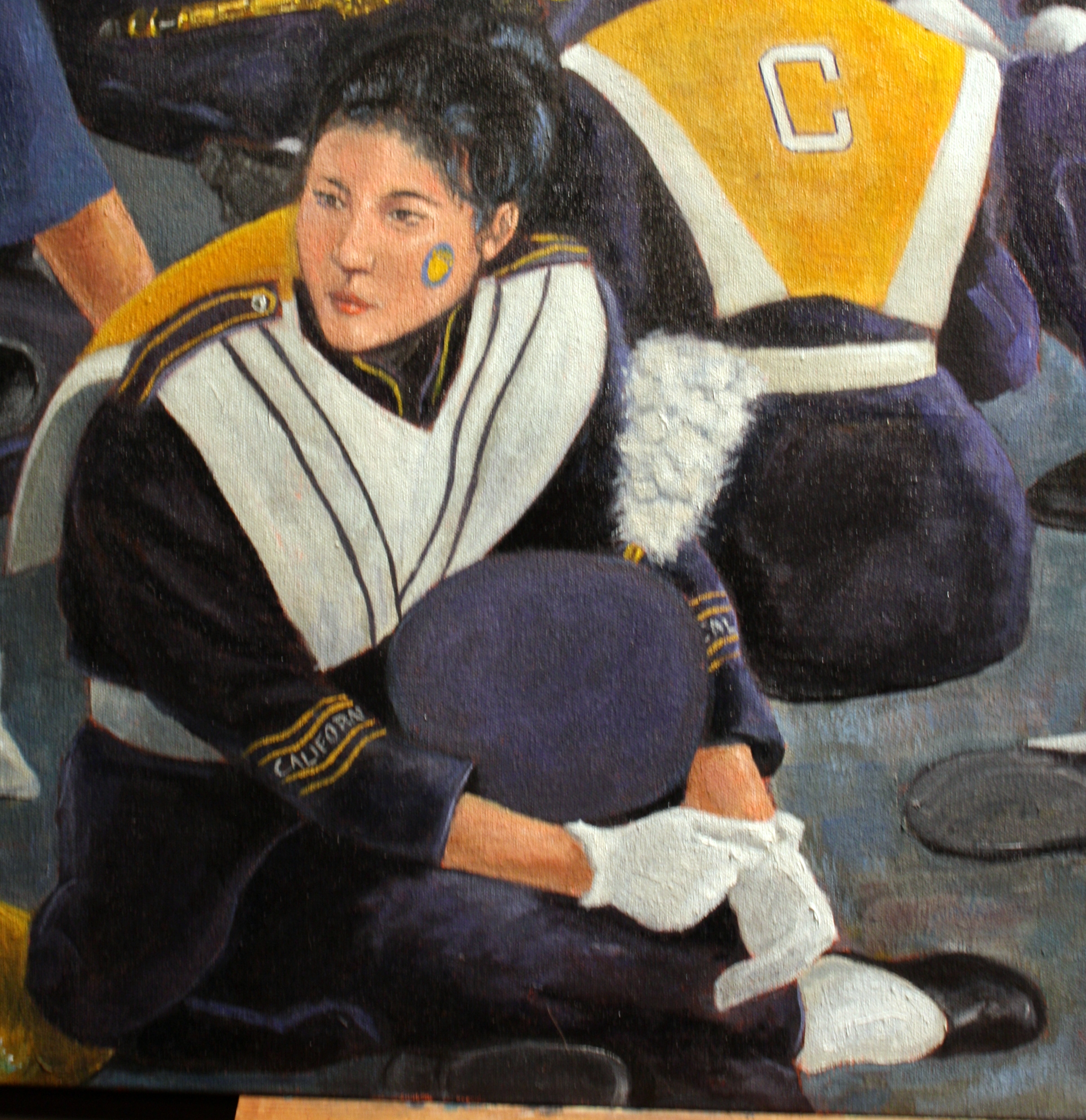 Cal Band Member Seated with Cap