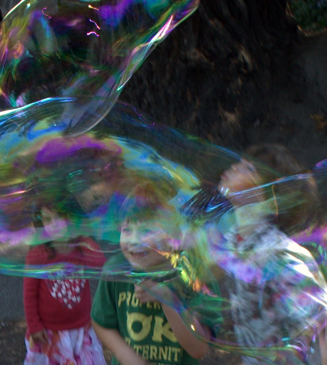Children Behind Giant Soap Bubbles